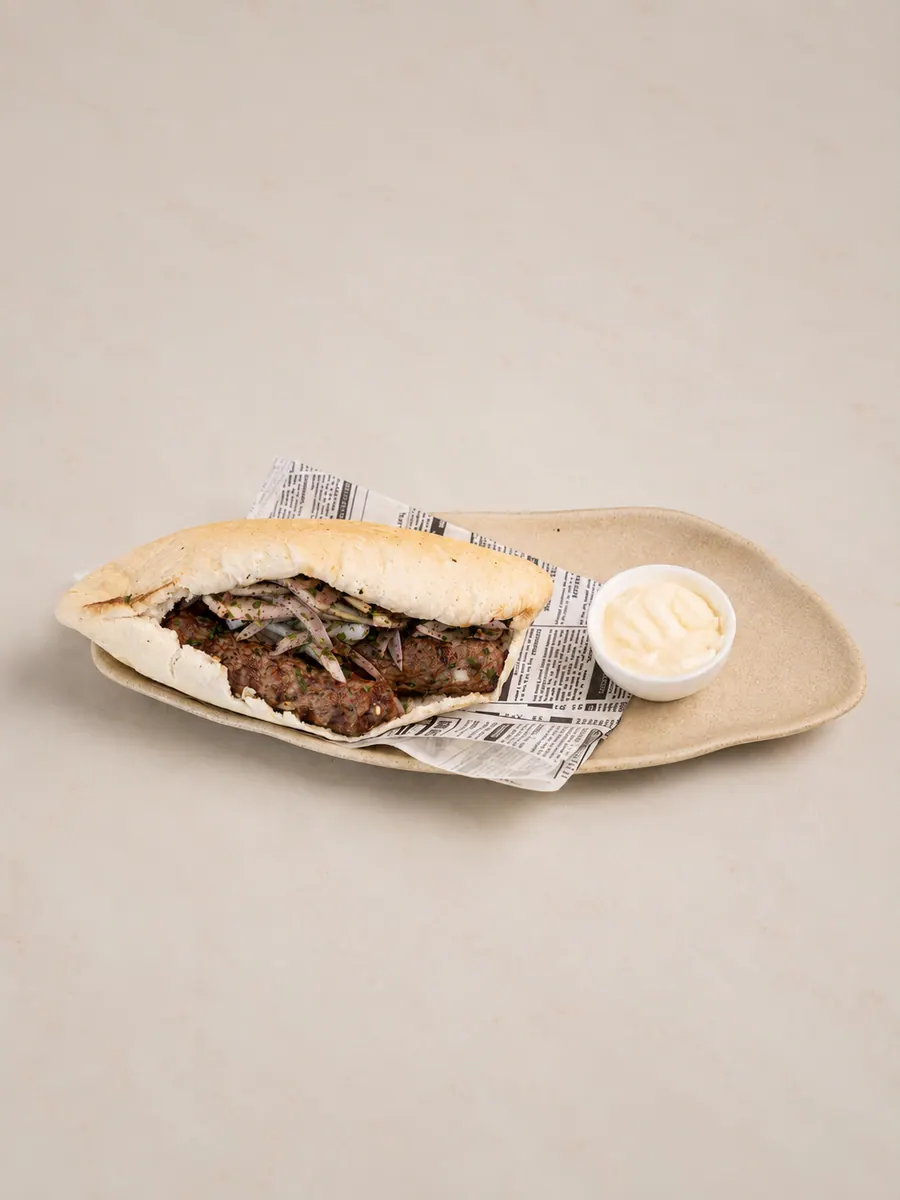 Al Reem Pita de Kafta: Minced kofta · vegetables · tarator · pickles · pita bread.